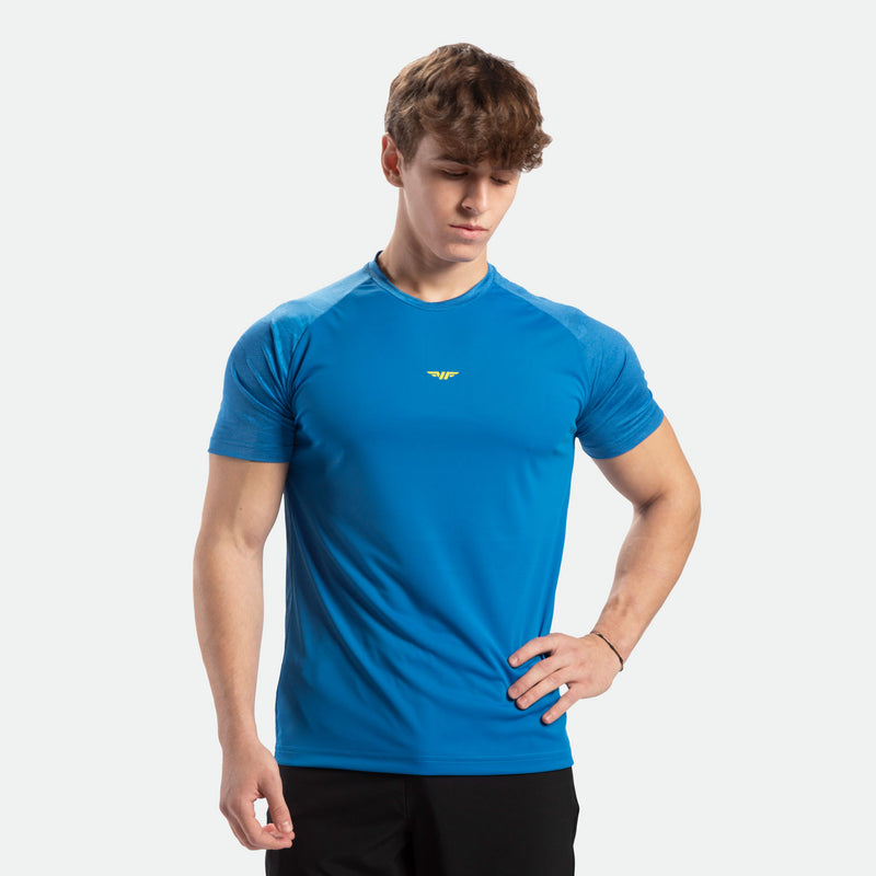 a fit man wearing t-shirt  azure blue with pants black 