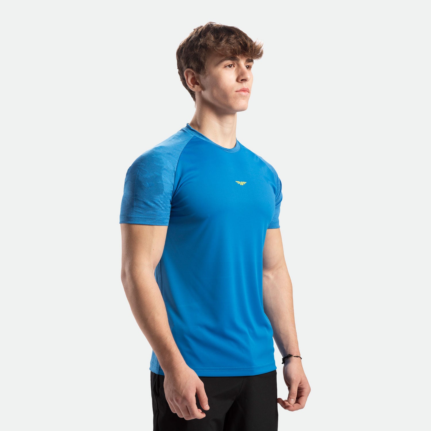 a fit man wearing t-shirt azure  blue with pants black 