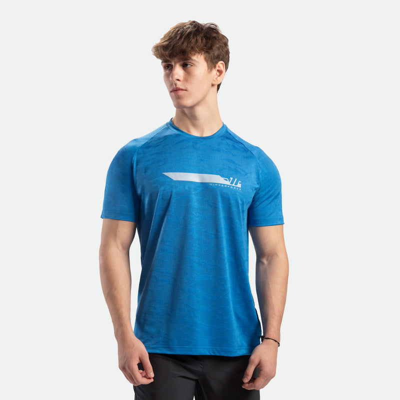 a fit man wearing t-shirt camo azure blue with logo and pants black 