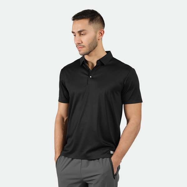 a fit man wearing t-shirt black with pants grey 