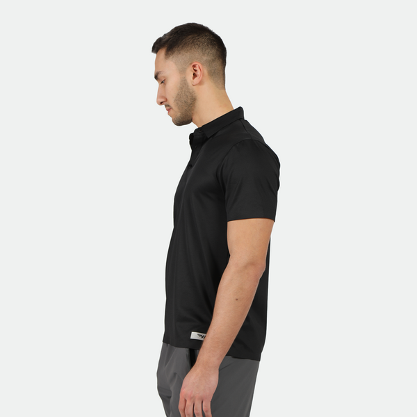 fit man stand at right and wearing t-shirt black with pants grey 