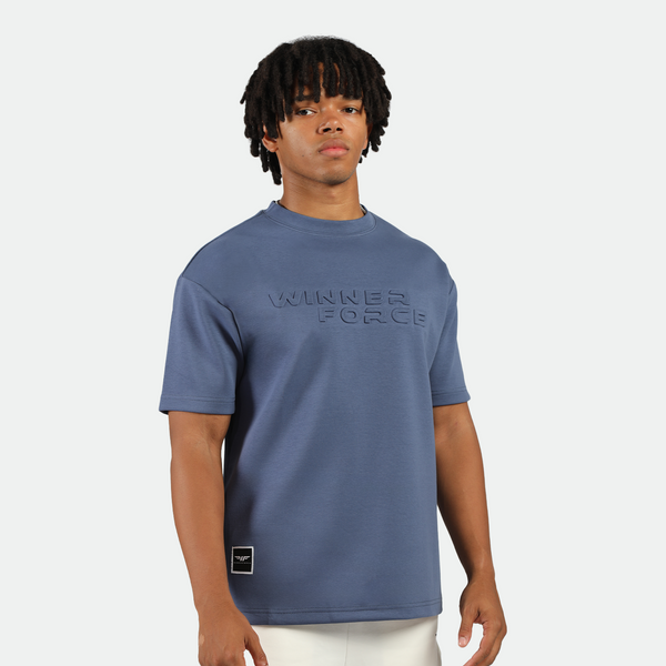 a fit man wearing t-shirt indigo blue with logo and short white 