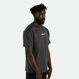 a fit man  wearing t-shirt dark grey with logo plus short dark grey 