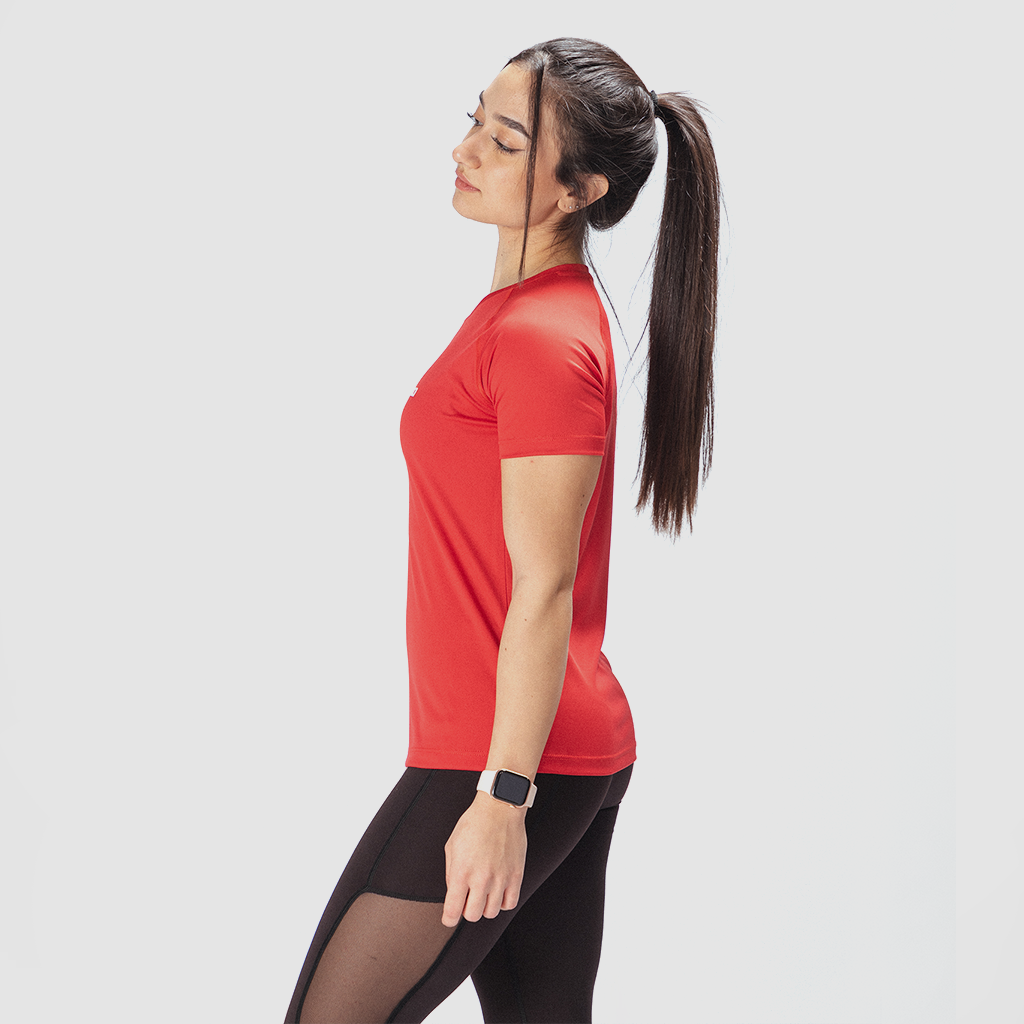 a fit woman wearing  stand at right and wearing t-shirt red with legging black have a little mesh fabric black 