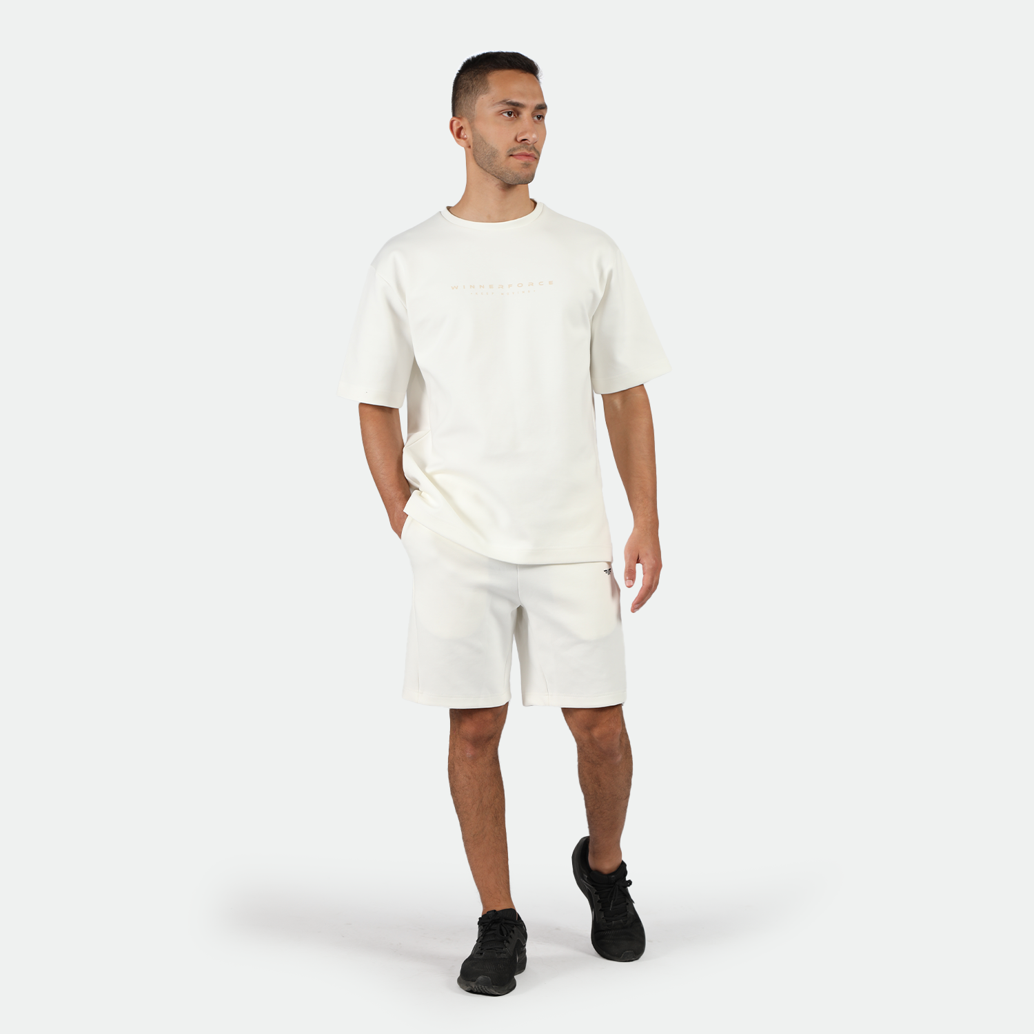 a fit man wearing matching set off white with shoes black 