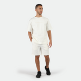 a fit man wearing matching set off white with shoes black 