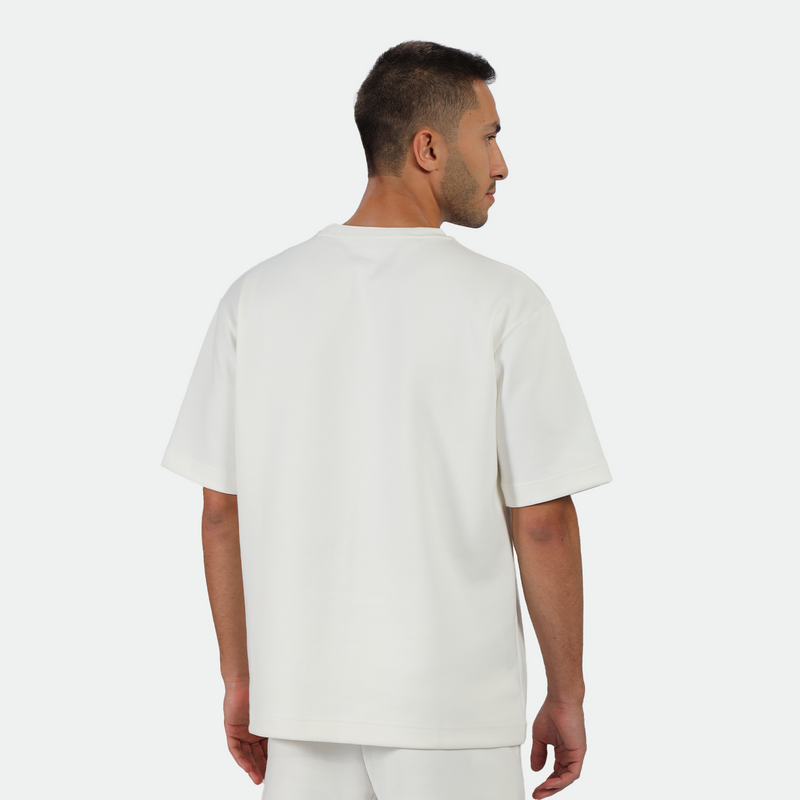 a back view for man wearing matching set off white ,t-shirt  and short 