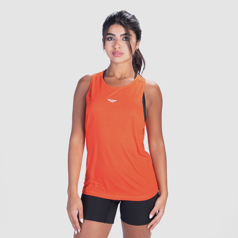  a fit woman wearing tank orange with short black 