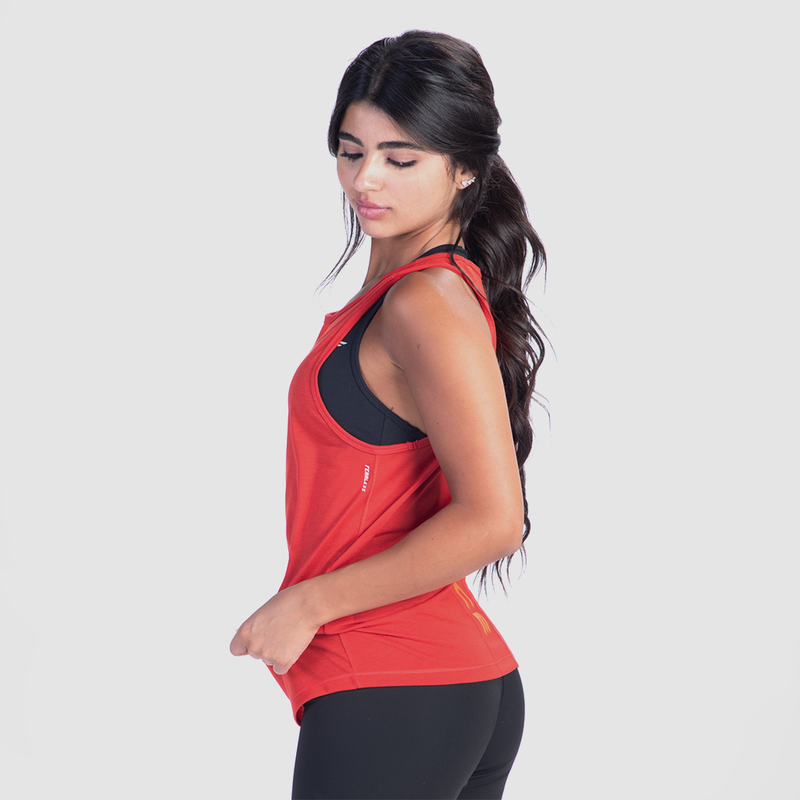a fit woman stand at right and wearing tank red with matching set bra and short black 