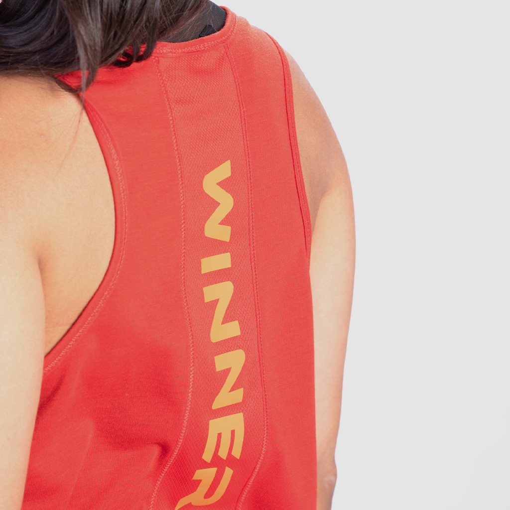 close up view for back view of girl wearing tank red with logo yellow