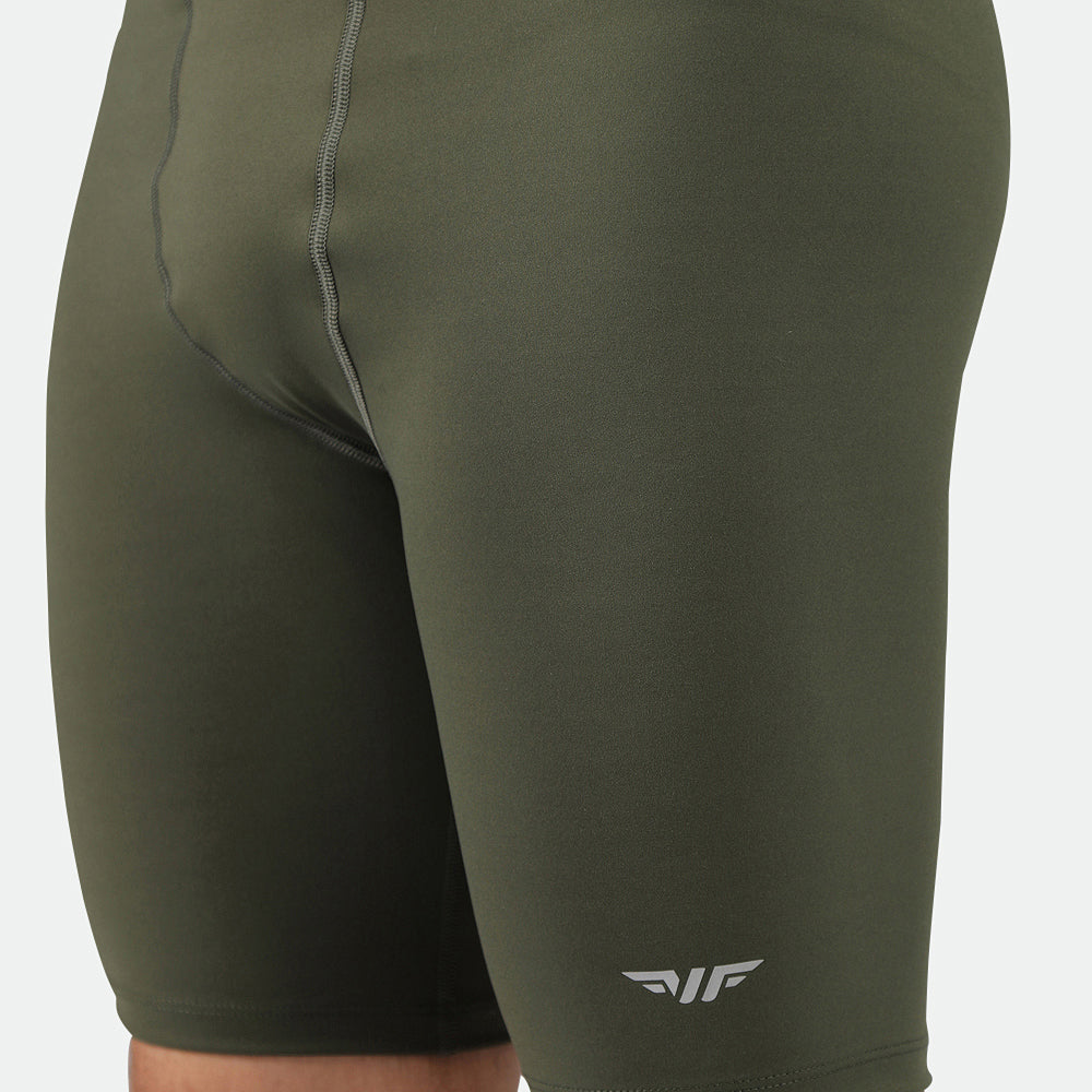 Olive green form-fitting athletic shorts with white logo on lower right leg. Visible stitching details give a sleek and comfortable look.