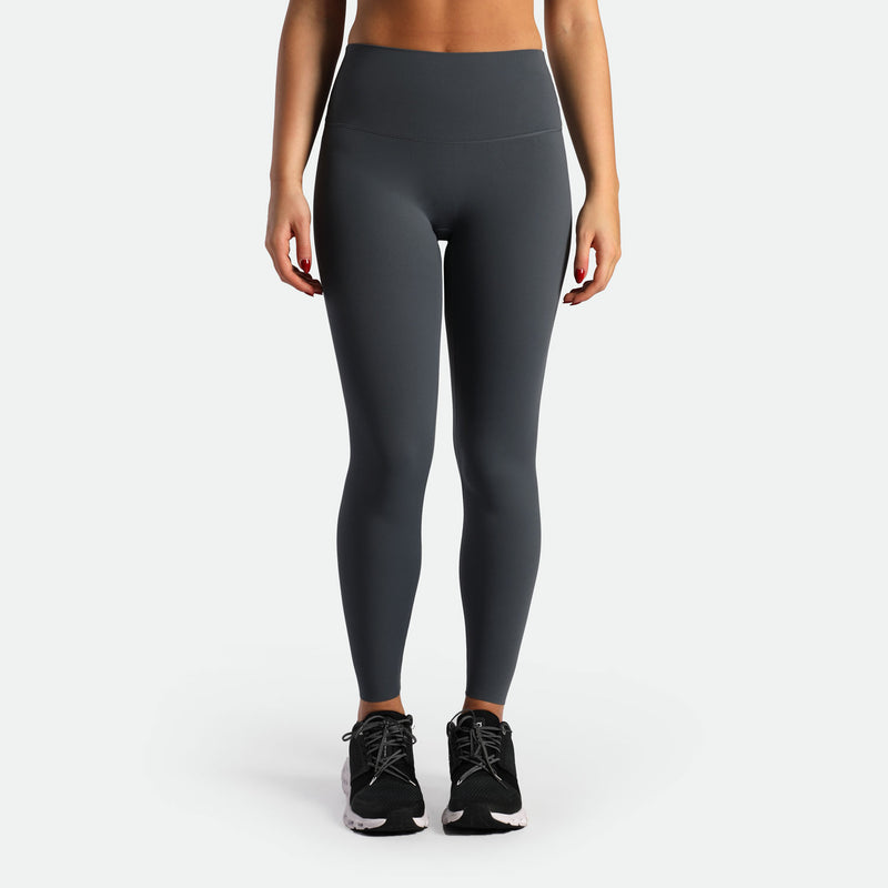 a fit woman wearing legging grey with shoes black 