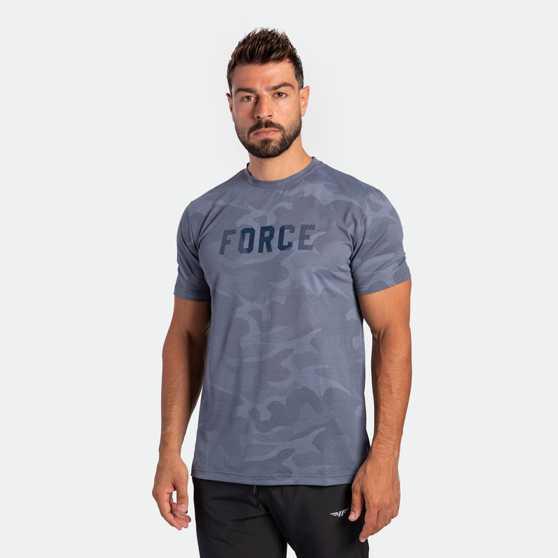 a fit man wearing camo t-shirt VINTAGE-INDIGO with pants  black 