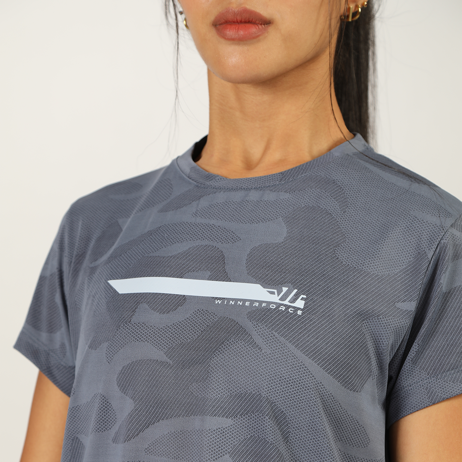 close up view for fit woman wearing t-shirt blue with logo 