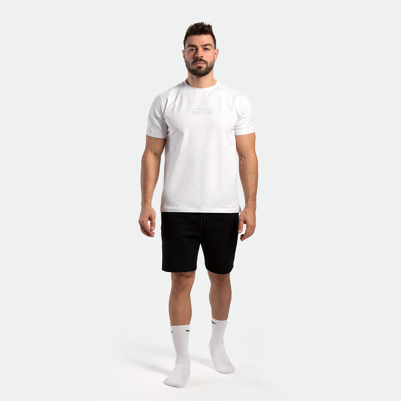 a fit man wearing t-shirt white with short black ,plus socks white 