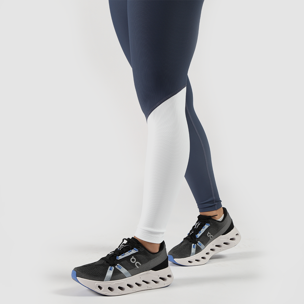 close up view for fit woman wearing legging mx two color  blue and white ,plus shoes 