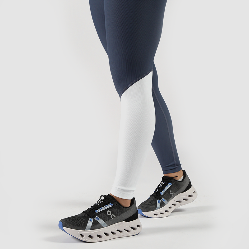 close up view for fit woman wearing legging mx two color  blue and white ,plus shoes 