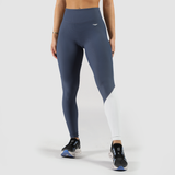 a fit woman  wearing legging mix  two color  blue and white , with logo white,  plus the shoes is same  color ,the background is light grey 