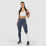 a fit woman wearing  bra white with legging  mix two color  blue and white with shoes 