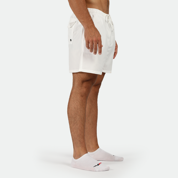 a fit man stand at right  and earing short white with socks white 
