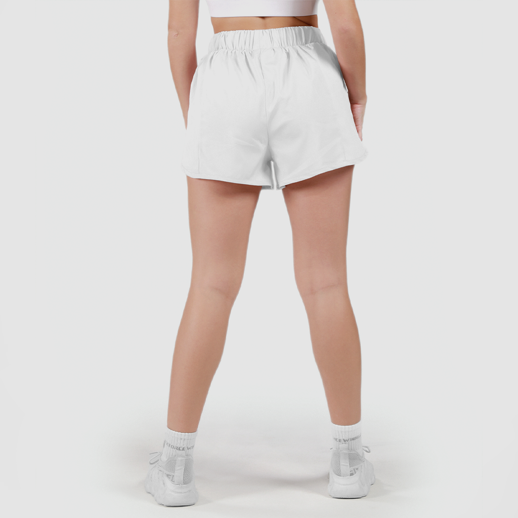 a back view for fit woman wearing short white 2 in 1 with shoes white ,plus the background is light grey 