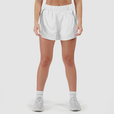 a fit woman wearing short white 2 in 1 with shoes  white ,plus the background is light grey 