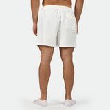 a back view for  man wearing short white  with socks white 