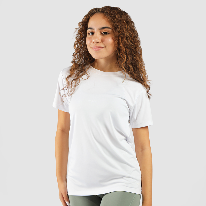 a fit woman look at the camera  with smile and wearing shirt white 
