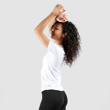 a fit woman  stand at right and she wearing t-shirt white  with legging black 