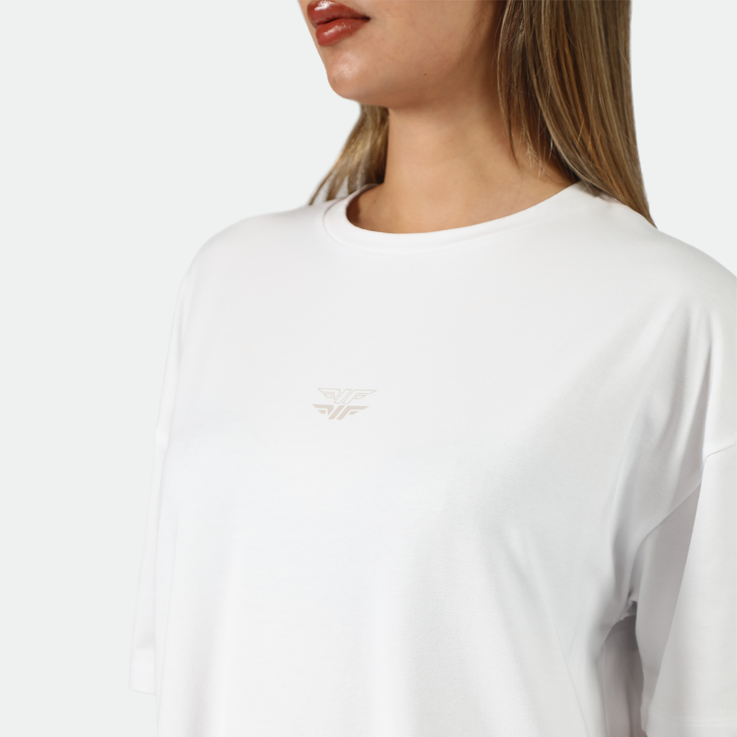 close up view for fit woman wearing white t-shirt with logo 