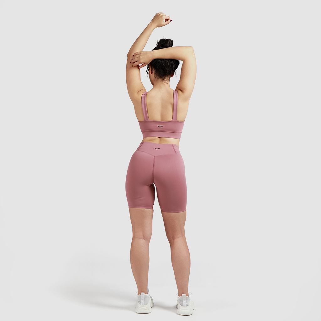 a back view  for woman wearing a matching bra and short, have same logo ,with background light grey  