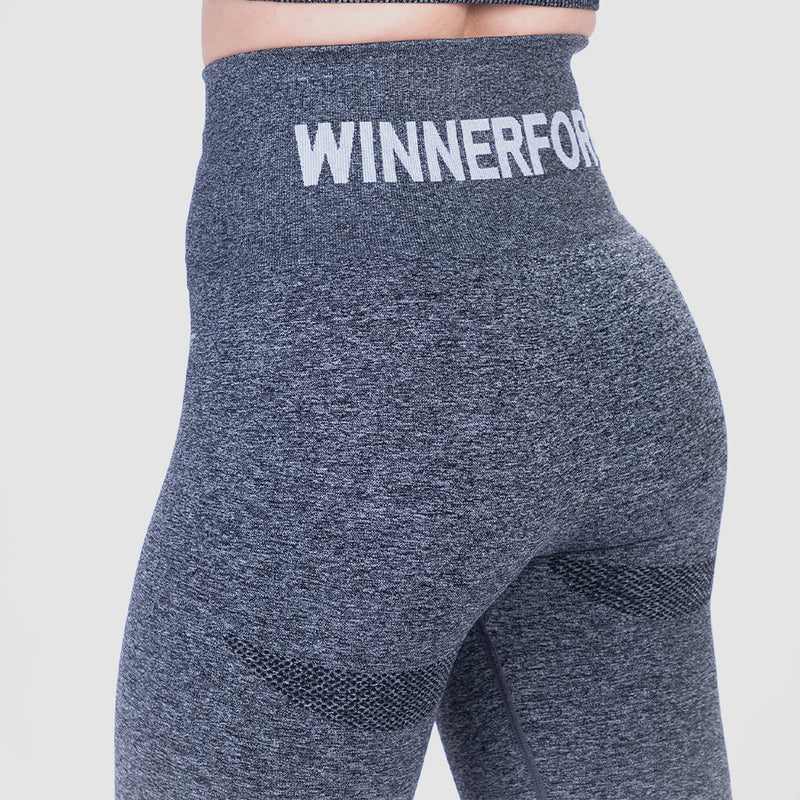 a back view for woman wearing  legging grey with bag logo ,the background is light grey 