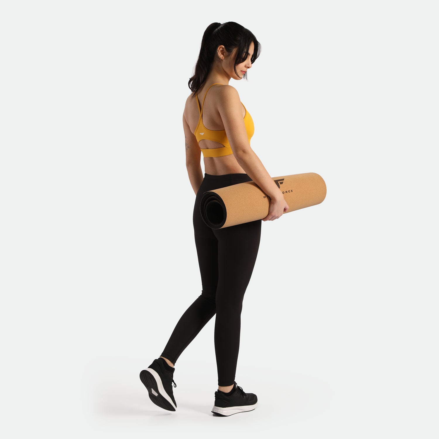 a back view for women wearing bra yellow and legging black ,have a logo