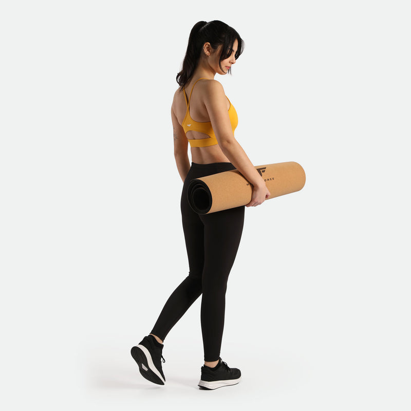 a back view for women wearing bra yellow and legging black ,have a logo