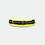 A neon yellow fanny pack with a black buckle and reflective stripes lies against a plain white background, offering a sporty and practical appearance.