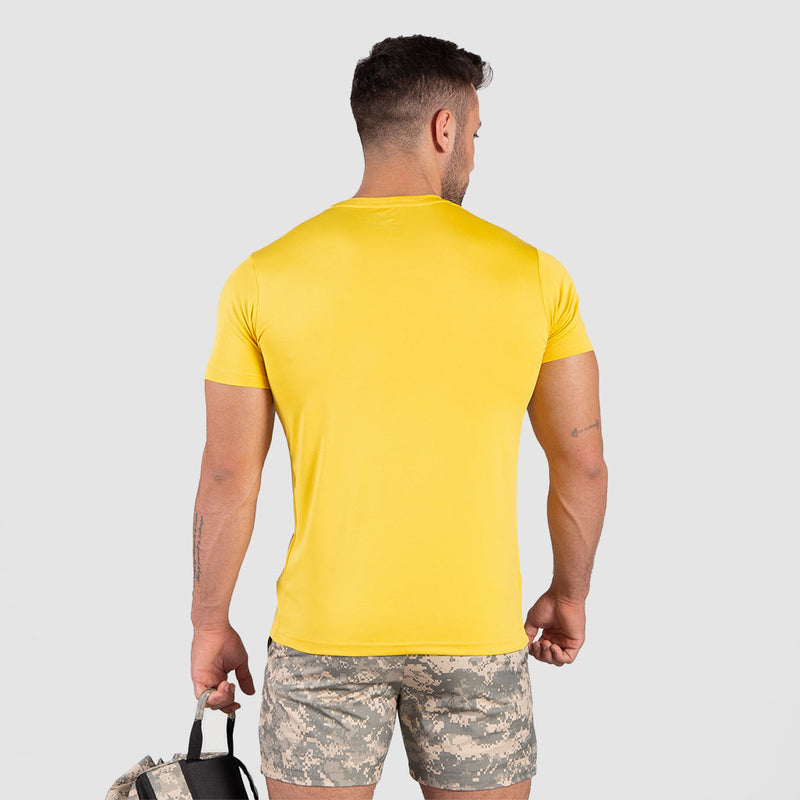 a fit man wearing t-shirt yellow with short acu grey 