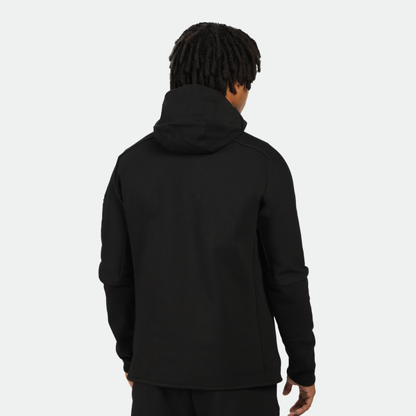 a back view for fit man wearing tech zipped hoodie black with pants black 