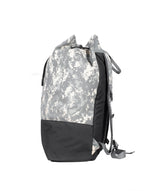 A drawstring bag with a gray digital camouflage pattern on the upper section and solid black fabric on the lower section ,the sides of backpack 