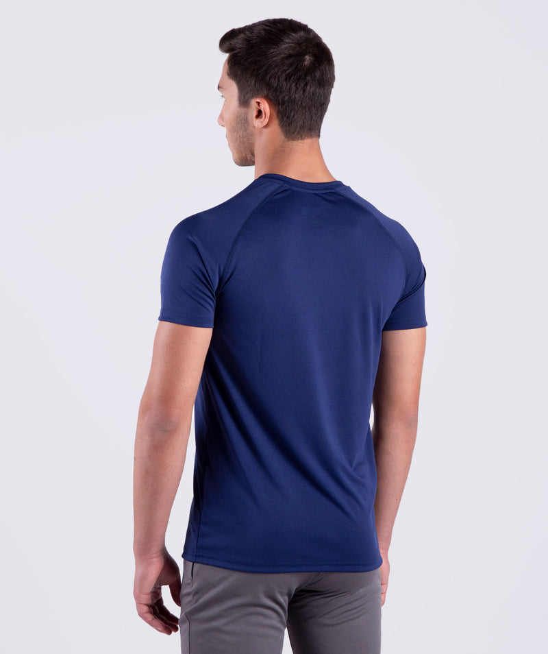 a back view for fit man  wearing t-shirt navy blue with pants grey 